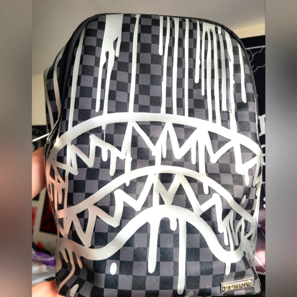 Sprayground backpack gray checkered and silver drip print